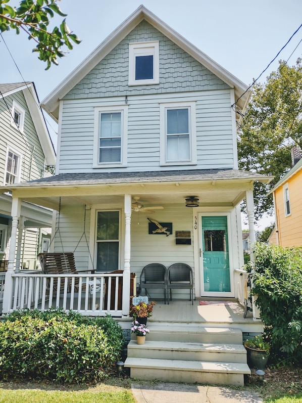 Cozy Cottage in summer.  Porch swing, of course!