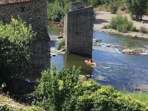 Watch the canoes and Kayaks go down the water shoot
