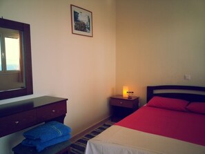 Double bedroom with wardrobe and dressing table with mirror