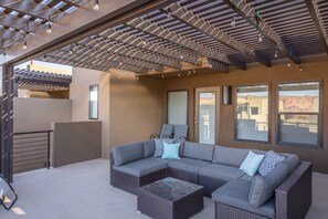 Upstairs Patio Seating Area - Read a book and enjoy the weather while you lounge around in the comfort on the upstairs patio area.