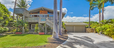 Street view showing off-street parking and front lanais with viewing deck 
