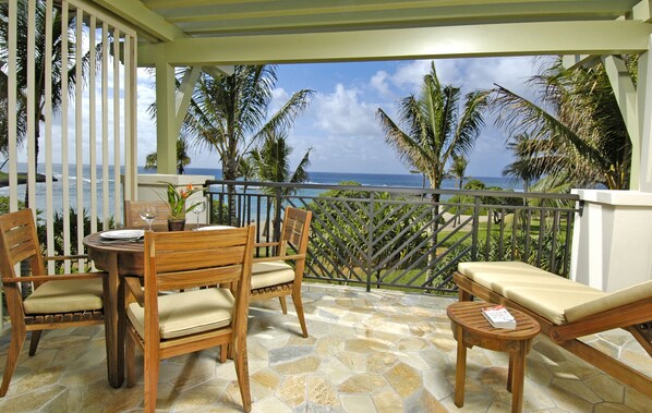 Ocean and beach view lanai! - Watch the whales breach from your lanai! There is a dining table with 4 chairs, a chaise lounge, and a side table