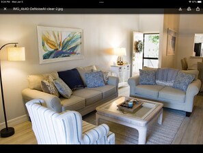 Spacious living room with cathedral ceilings.
