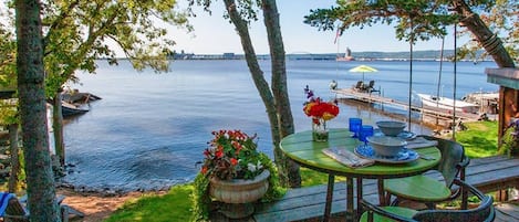 Tasty treats on the deck while your toes are practically touching the bay!

Yes, those chairs and fishing poles on the dock are waiting for you!