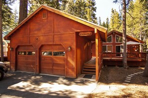 Two cars fit in the garage, and four cars can fit in the driveway.