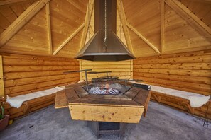 Enjoy a cosy night cooking food on the fire in Brackens BBQ hut