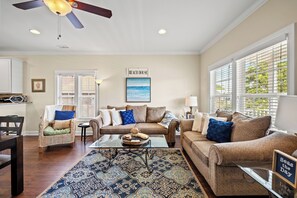 Gather the family for a movie night. Roku included in the living room.