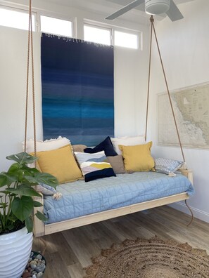 slip onto the cozy hanging couch for the sunset and some tv later...