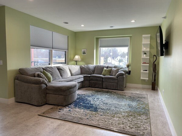 Super comfortable sectional with recliner & memory foam queen sleeper