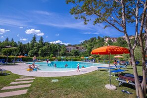 The swimming pool of the Hotel Pineta Campi 200 meters away