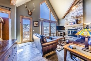 Living room - Spacious, mountain modern design. All the comforts of home. Gas fireplace. Large windows for plenty of natural light