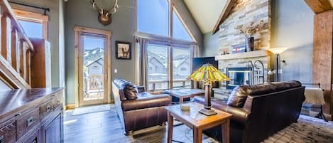 Living Room - Spacious, mountain modern design. All the comforts of home. Gas fireplace. Large windows for plenty of natural light.