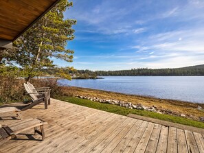 Relax on this deck just above the waters edge