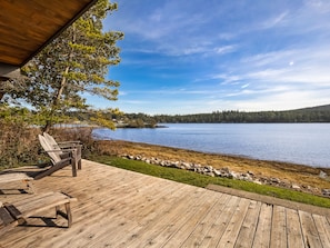 Relax on this deck just above the waters edge