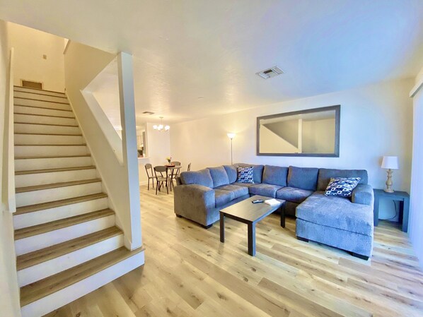 Spacious Living Room with Oversized Comfy Sectional Sofa. 65" Fire Tv