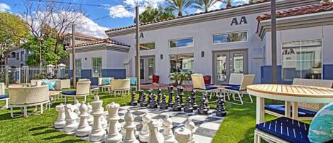 Have fun with the community giant chess board near the main pool