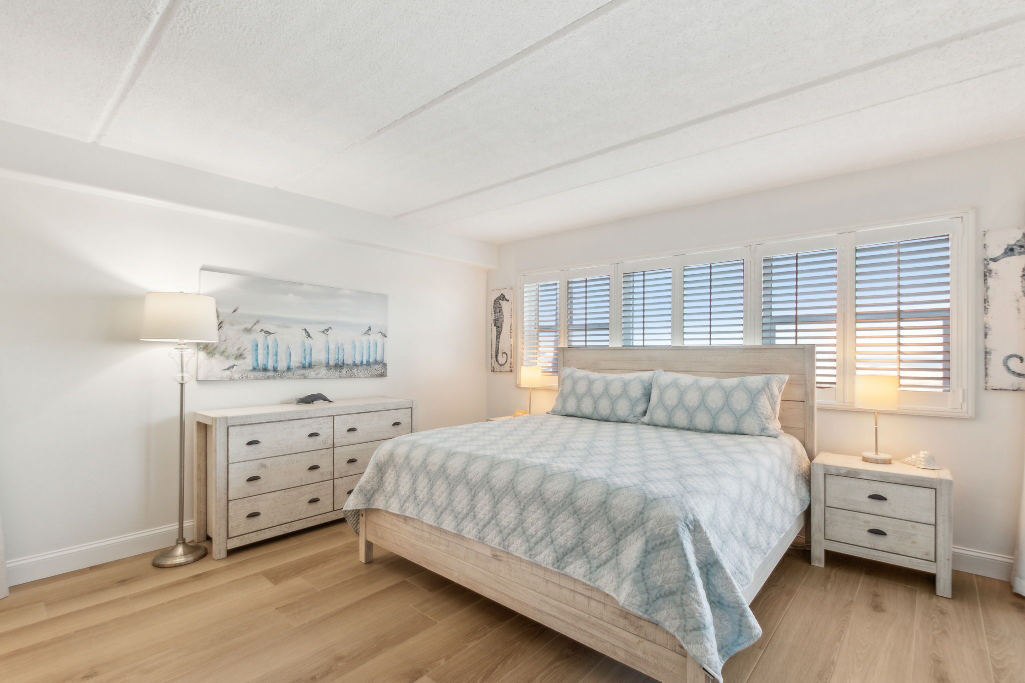 Master Bedroom with Ocean Front Views, Private Access to the Patio, and a Flat Screen Smart TV (King Bed)