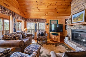 cozy living room with TV and fireplace