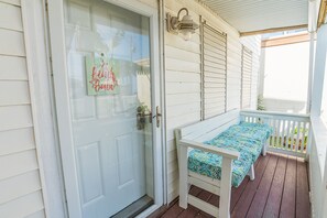 Built in porch bench (cushions inside the house) for coffee (or whatever) sipping