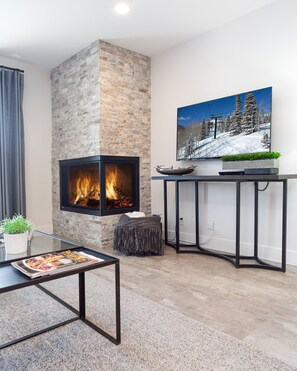 Cozy Gas Fireplace, New 65 installed Flatscreen, with built in, Apple TV, Roku, 