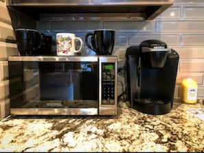 Make a hot cup of coffee with the Keurig.