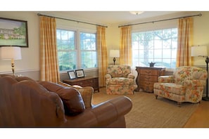 Living Room:  Cozy seating arrangement near the fireplace.