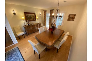 Dining Room: Formal dining room with seating for eight and buffet service.