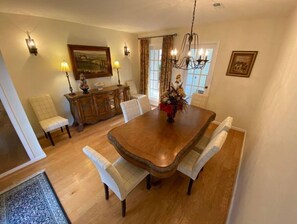 Dining Room: Formal dining room with seating for eight and buffet service.