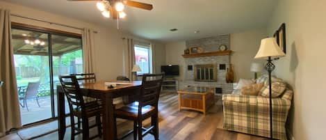 The kitchen opens to the living room. Dining table seats 6. 