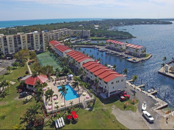 aerial view of complex. 6 story condo bldg on top left of picture