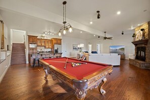 Our secondary living space is complete with a full-size pool table, 75-inch LG Smart TV, and a kitchenette.