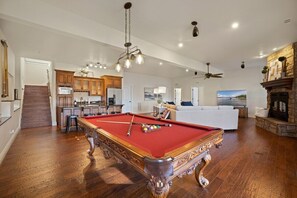 Our secondary living space is complete with a full-size pool table, 75" LG Smart TV, and a kitchenette.