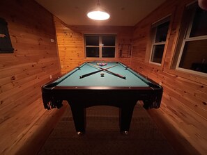 It also includes a billiard area with a full-size pool table