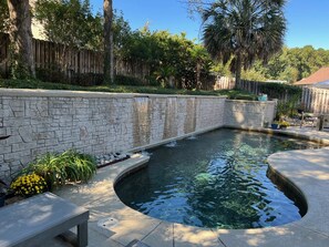 View of pool with waterfalls.