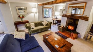 Living room with log burner, Granary at Hunt Court, Bolthole Retreats