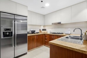 Kitchen: Sleek appliances and stylish counter space await your culinary adventures!