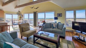 Multiple sliders provide access to the deck and an incredible view of the bay