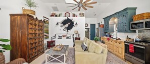 Lovely curated decor. Vaulted dormer creates light and volume yet still so cozy.