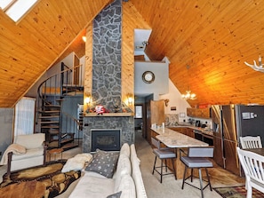 Enjoy the living room with a gas fireplace and tall ceilings.