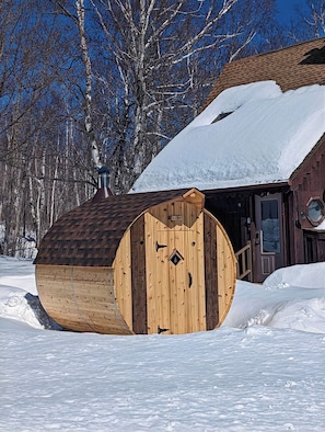Enjoy a cedar 7x8 wood burning barrel sauna.