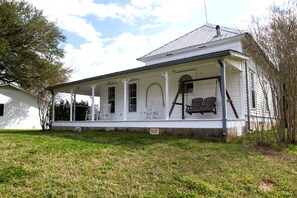 A view of the Back of the House and it's Wrap-Around Porch. Enjoy the view!