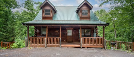 Front of cabin and 2 parking spots.