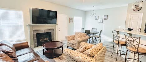 Living room opens to the dining area and the kitchen