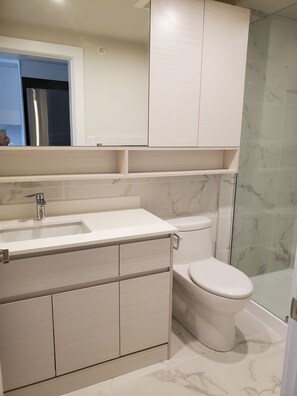 Large walk in shower and full size bathroom.  Beautiful tile throughout.