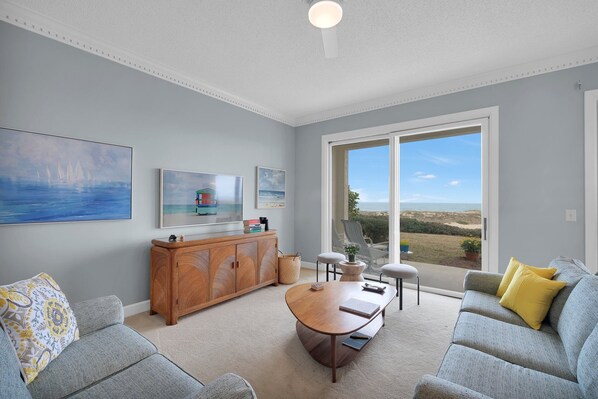 Open concept living room with eastern views to the dunes, beach and Atlantic.