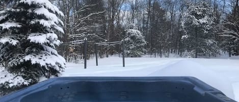 Relax in our double powered hot tub gazing at the stars with snow flakes falling