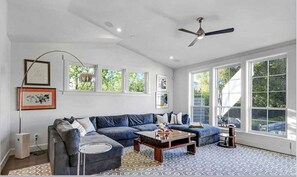 Large family room with view of pool and rear garden 