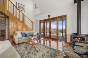 Living area facing the ocean and farm views 