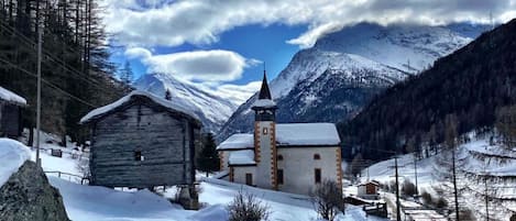 Cloud, Snow, Mountain, Sky, Property, Building, Window, Nature, Slope, House