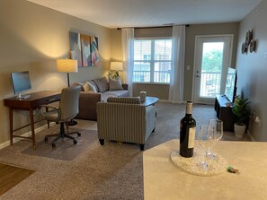Open concept living area! You can relax on the couch, cook in the kitchen, work from the desk, or eat at the table...all in the main living area.